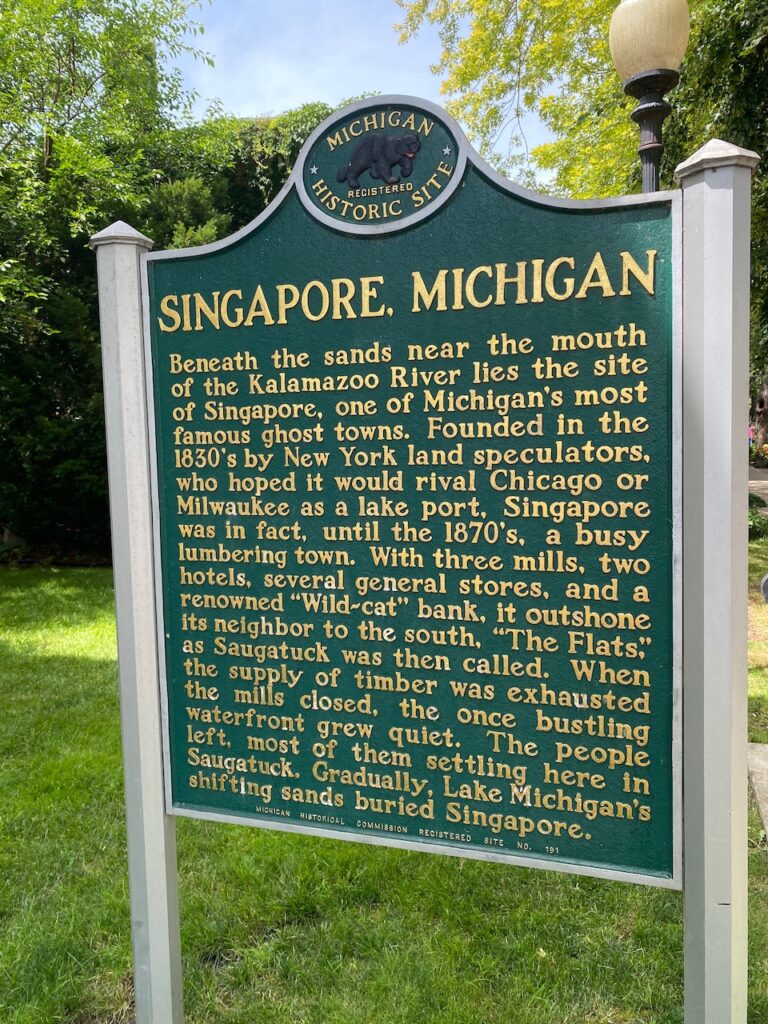 green Michigan Historic Site sign with story about Singapore, Michigan